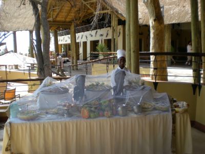 mosquito netting covers a lavish buffet